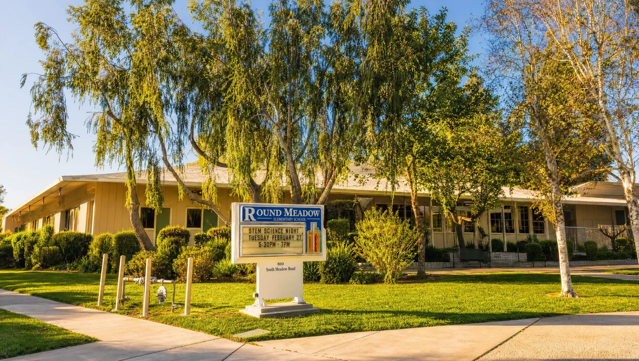 Round Meadow Elementary School entrance sign and campus near the Hidden Hills entrance
